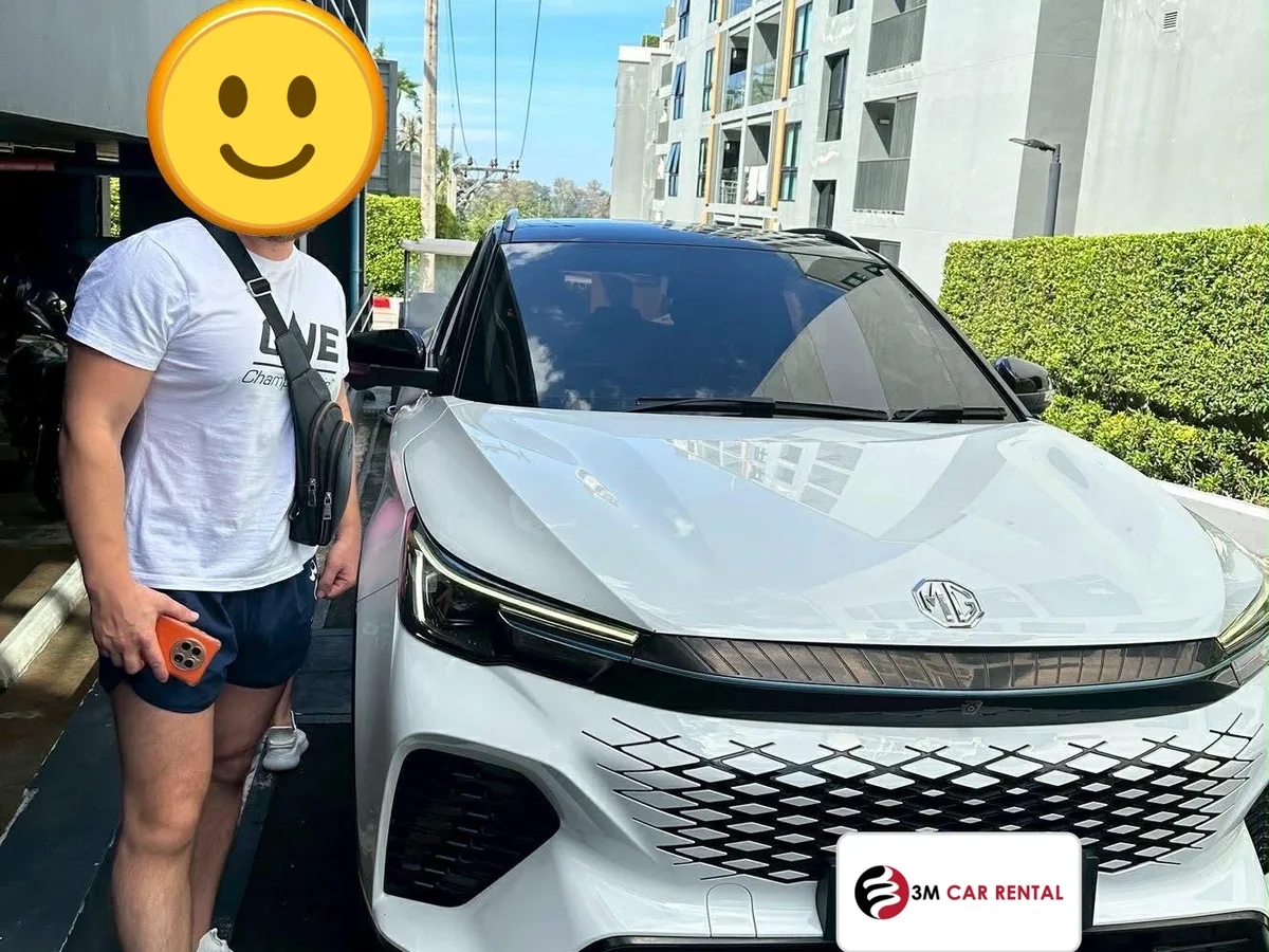 Guest with a white MG rental car in Phuket town